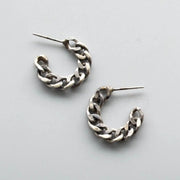 Matte oxidized stud earrings are transformed salvaged chains hand-fabricated into hoops. 