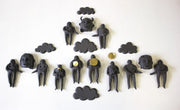 False Testimonies. Ceramic with gold leaf wall sculpture composed of 19 variable elements, this installation measuring 64 x 104 x 4 cm. 