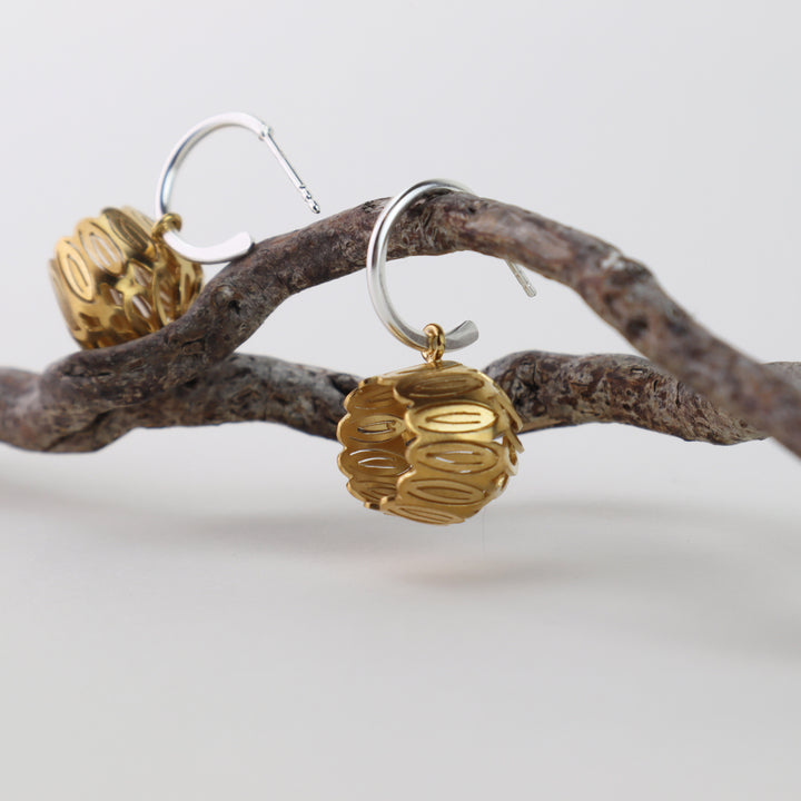 Golden Tulip Hoops  2.5 x 1.5 x 1.5 cm  Sterling silver, 14k gold Vermeil  Techniques: Hand cut silver, gold plating