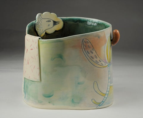 Ceramic vase sculpture with a woman design