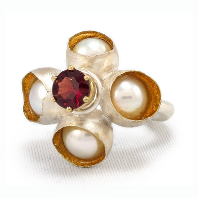Queen of Hearts Ring. with a garnet surrounded by freshwater pearls that float in resin with 22k gold leaf interiors, 32 x 27 x 25mm, 6.75.