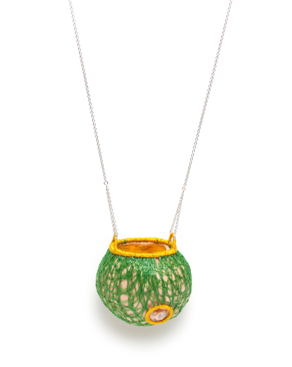 Les fruits #3, pendant of porcelain, silver, gold leaf, and embroidery thread. 