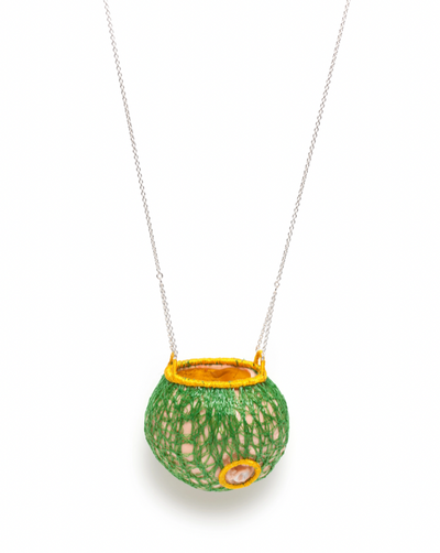 Les fruits #3, pendant of porcelain, silver, gold leaf, and embroidery thread. 