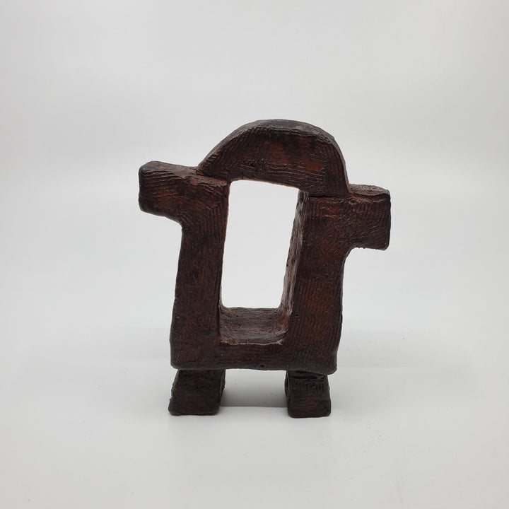 Dualité sculpture in bronze. The minimalist shape of this piece is complimented by the ornate etching that covers the sculpture.   12 x 10 x 4 cm