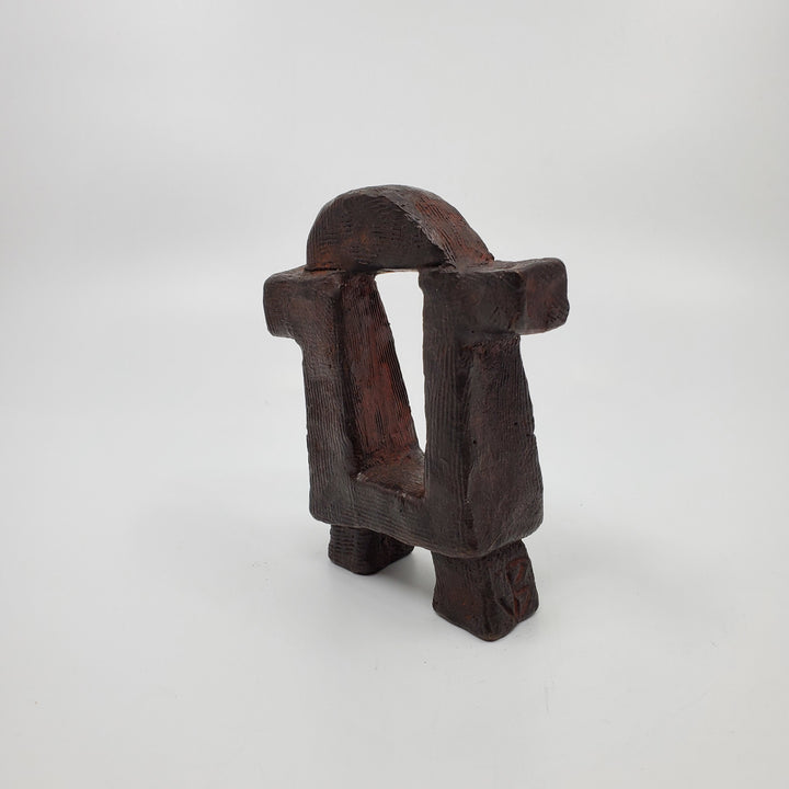 Dualité sculpture in bronze. The minimalist shape of this piece is complimented by the ornate etching that covers the sculpture.   12 x 10 x 4 cm