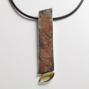 ge pendant with a marquise cut citrine and long slab of slate set in sterling silver (14 x 3 cm) on a 40 cm long rubber coil.