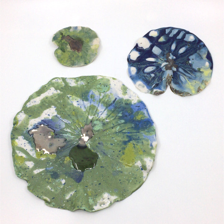 Medium lily pads made from multi-fired porcelain that can be hung or laid flat. These are stunning when shown together or paired with Lisa's lily flowers.