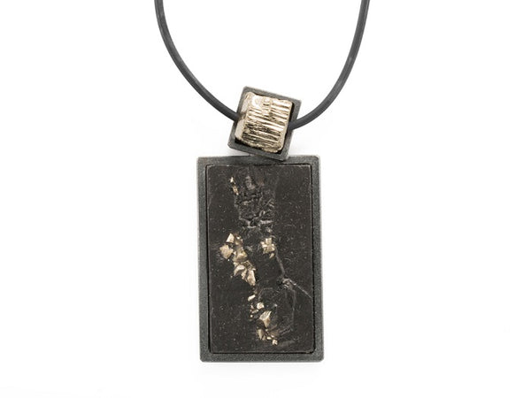 Pyrite pendant on a rubber collar