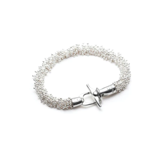 The bright fine and sterling silver ShikShok bracelet has a beautiful heft to it. 7.5" or 20 cm long, and with a specially designed magnetic clasp for extra safety.