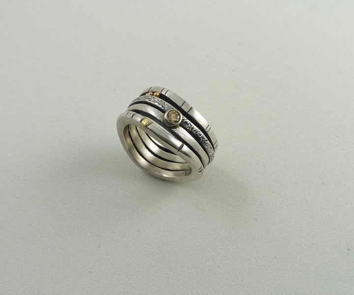 Stacked Ring - sterling silver band with 14k gold detail and embellished with a 11pt champaign diamond.  Size 7, 8.0 cm in width.