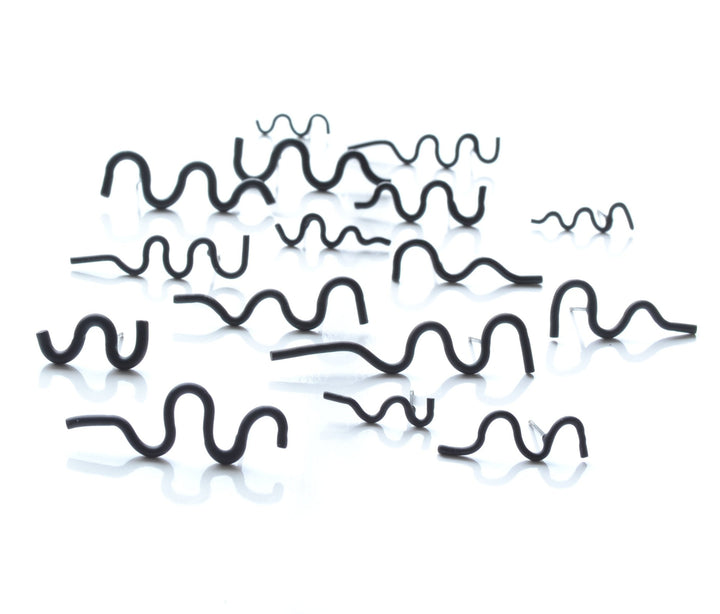 Squiggle stud earrings are colourfully powder coated copper on surgical stainless steel posts. Each is sold as a  single earring so different combinations are possible. We have a wide selection of colours in the gallery!