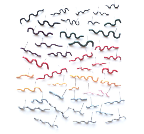 Squiggle stud earrings are colourfully powder coated copper on surgical stainless steel posts. Each is sold as a  single earring so different combinations are possible. We have a wide selection of colours in the gallery!