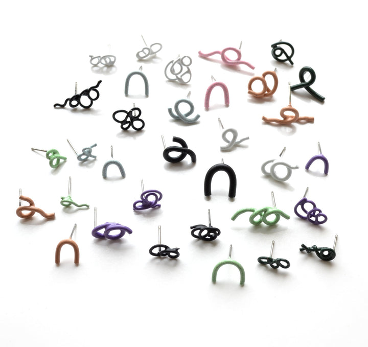 Twist Earrings are powder-coated copper on surgical stainless steel posts. Each earring is sold individually so you can mix and match a much as you like. We have a wide selection of colours and forms in the gallery!