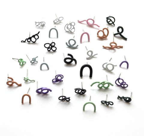 Twist Earrings are powder-coated copper on surgical stainless steel posts. Each earring is sold individually so you can mix and match a much as you like. We have a wide selection of colours and forms in the gallery!
